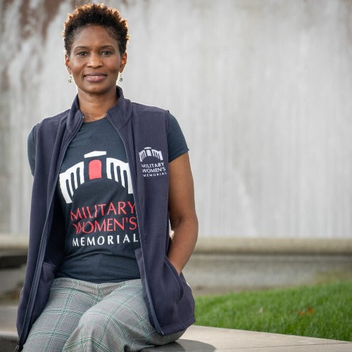 Dark blue vest with Military Women’s Memorial embroidered on the left chest. 